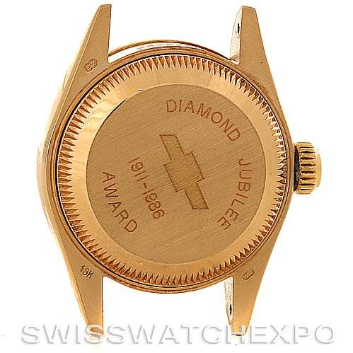 This image shows the back case of a Rolex President 69178 Women's Yellow Gold Champagne Dial 69178 Women's Yellow Gold Champagne Dial model watch, including the crown and lug parts.