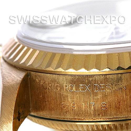 The image shows a close-up of the side of a Rolex President 69178 Women's Yellow Gold White Dial 69178 Women's Yellow Gold White Dial watch, highlighting the fluted bezel, crystal edge, and engraved model details.
