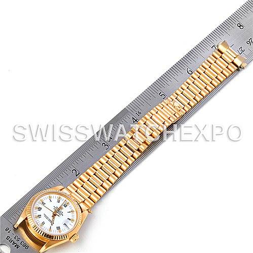 The image shows a top-down view of a Rolex President 68273 Women's Yellow Gold White Dial 68273 Women's Yellow Gold White Dial model watch, including the full face, band, and a measuring ruler.