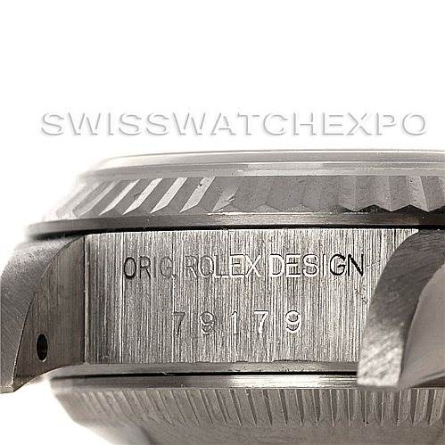 This image shows a close-up of the case side and the lugs of the Rolex President 79179 Women's White Gold Pink Dial 79179 Women's White Gold Pink Dial model, including its serial number and "ORIG ROLEX DESIGN" engraving.