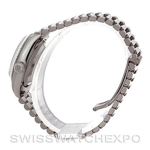 This side-angle view shows the Rolex President 79179 Women's White Gold Pink Dial 79179 Women's White Gold Pink Dial watch casing, crown, and bracelet.