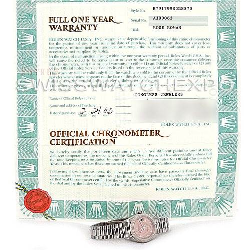 The image shows a Rolex President 79179 Women's White Gold Pink Dial 79179 Women's White Gold Pink Dial model watch placed below its full one-year warranty and official chronometer certification papers.