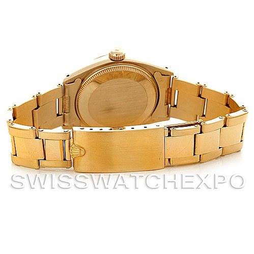 This image shows the rear view of a Rolex President 6827 Women's Yellow Gold Silver Dial 6827 Women's Yellow Gold Silver Dial model watch, highlighting the case back and bracelet with a clasp.