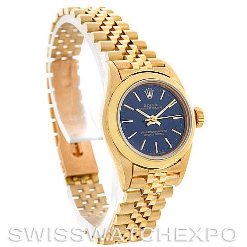 The image shows a Rolex President 67188 Women
s Yellow Gold Blue Dial 67188 Women
s Yellow Gold Blue Dial model watch at a three-quarter angle, highlighting its blue dial and gold bracelet.