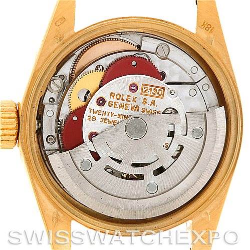 The image shows the open case back of a Rolex President 67188 Women
s Yellow Gold Blue Dial 67188 Women
s Yellow Gold Blue Dial model, displaying its intricate movement and inner components.
