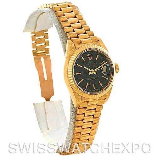 This image shows a side view of a Rolex President 69178 Women's Yellow Gold Black Dial 69178 Women's Yellow Gold Black Dial model watch, highlighting its gold bracelet, black dial, and crown.