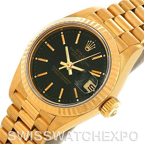 This image shows a Rolex President 69178 Women's Yellow Gold Black Dial 69178 Women's Yellow Gold Black Dial model watch viewed from an angled perspective, displaying the face, bezel, crown, and bracelet partly.