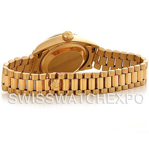 The image shows the back and bracelet of a Rolex President 69178 Women's Yellow Gold Black Dial 69178 Women's Yellow Gold Black Dial model watch, highlighting the clasp and crown.