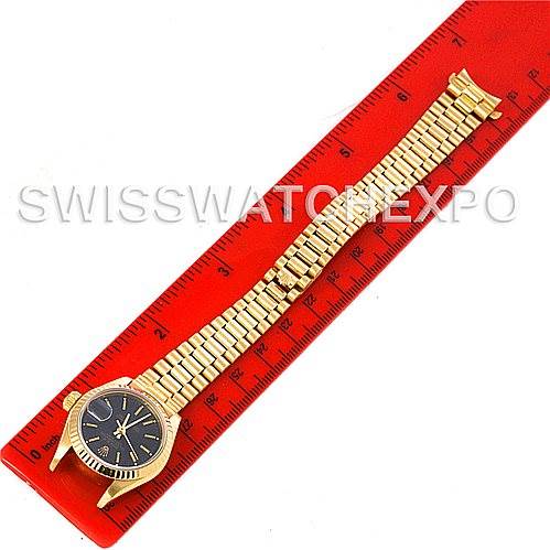 This image shows a top-down view of a Rolex President 69178 Women's Yellow Gold Black Dial 69178 Women's Yellow Gold Black Dial model, including the watch face and full bracelet, measured against a red ruler.
