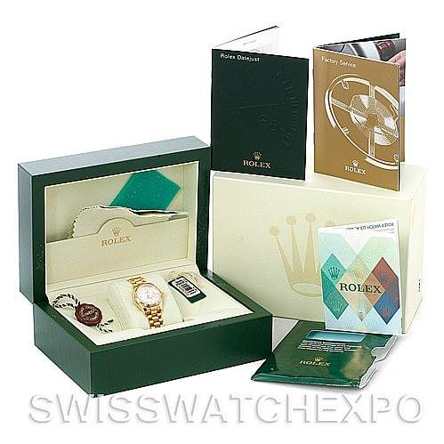 This image shows a Rolex President 179178 Women
s Yellow Gold Silver Dial 179178 Women
s Yellow Gold Silver Dial model watch in its box, accompanied by manuals, tags, and a warranty card.
