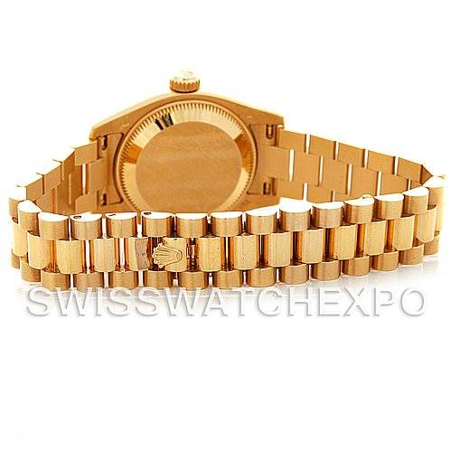 The image shows the back view of a Rolex President 179178 Women
s Yellow Gold Silver Dial 179178 Women
s Yellow Gold Silver Dial model watch, highlighting the case back and bracelet.