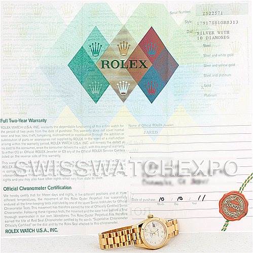The image shows a Rolex President 179178 Women
s Yellow Gold Silver Dial 179178 Women
s Yellow Gold Silver Dial model watch along with its warranty and certification documents.