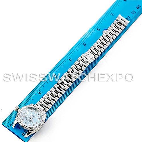 The image shows a Cartier Tank Francaise 179136IBLDP Women's Stainless Steel Blue Dial 179136IBLDP Women's Stainless Steel Blue Dial watch laid flat and measured next to a blue ruler, displaying its band and face.