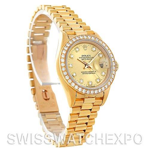 The Rolex President 69278 Women's Yellow Gold Champagne Dial 69278 Women's Yellow Gold Champagne Dial model watch is shown at a slight angle showcasing the face, bracelet, and bezel, with diamonds around the bezel.