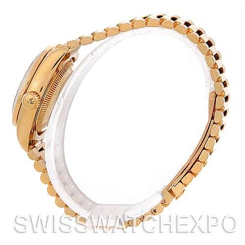 This image shows a side view of a Rolex President 69278 Women's Yellow Gold Champagne Dial 69278 Women's Yellow Gold Champagne Dial model watch, highlighting the crown and bracelet.