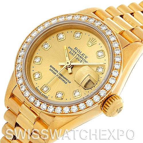 This image shows a close-up, top view of the Rolex President 69278 Women's Yellow Gold Champagne Dial 69278 Women's Yellow Gold Champagne Dial watch, highlighting the gold case, diamond bezel, dial, and bracelet.