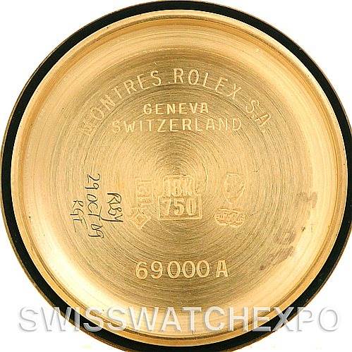 The image shows the inside of a Rolex President 69278 Women's Yellow Gold White Dial 69278 Women's Yellow Gold White Dial watch case back, including engravings and the model number 69000 A.