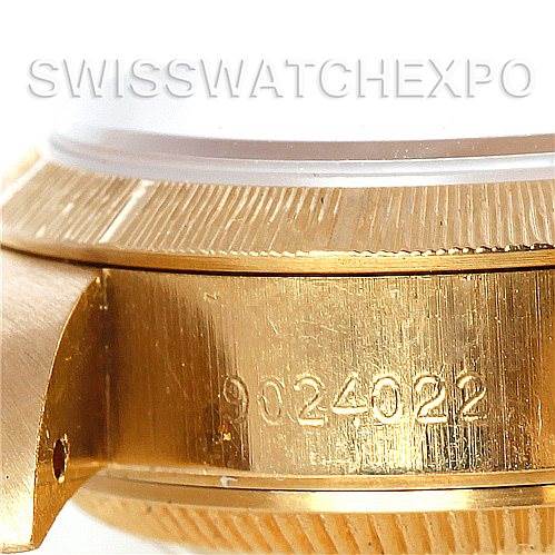 This close-up image shows the side and bezel area of a Rolex President 69278 Women's Yellow Gold White Dial 69278 Women's Yellow Gold White Dial model watch, highlighting its serial number.