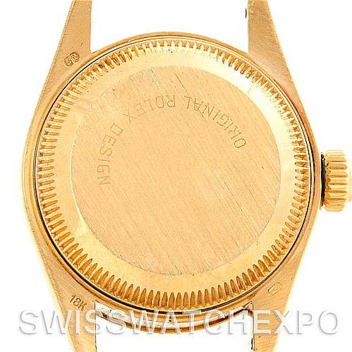 This image shows the back case and crown of a Rolex President 69278 Women's Yellow Gold White Dial 69278 Women's Yellow Gold White Dial model watch from a top-down angle.