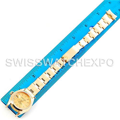 The image shows a Rolex President 69168 Women's Yellow Gold Champagne Dial 69168 Women's Yellow Gold Champagne Dial model watch placed beside a blue ruler for scale, displaying the watch face and full bracelet.
