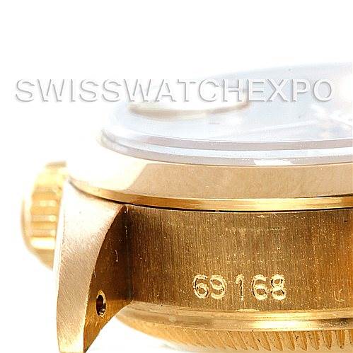 The image shows a side angle of the gold casing, a portion of the crown, and a serial number engraving on the Rolex President 69168 Women's Yellow Gold Champagne Dial 69168 Women's Yellow Gold Champagne Dial model watch.