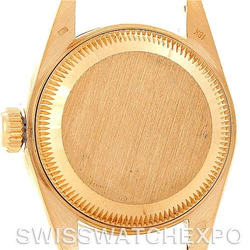 This image shows the case back and crown of a Rolex President 69168 Women's Yellow Gold Champagne Dial 69168 Women's Yellow Gold Champagne Dial model watch.