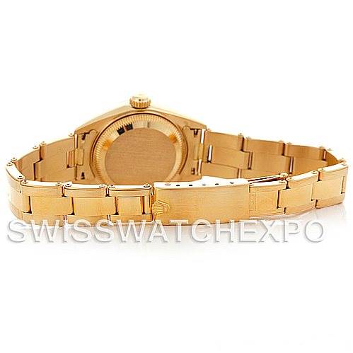 The image shows the back and bracelet of a Rolex President 69168 Women's Yellow Gold Champagne Dial 69168 Women's Yellow Gold Champagne Dial model watch in gold.