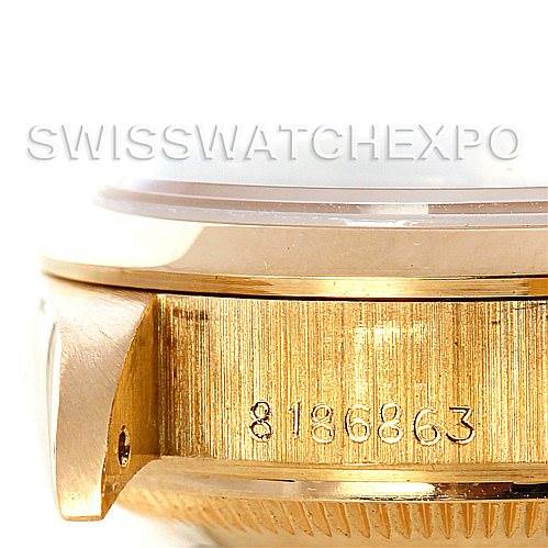 This image shows a close-up of the serial number on the side of the case of a Rolex President 69168 Women's Yellow Gold Champagne Dial 69168 Women's Yellow Gold Champagne Dial model watch.