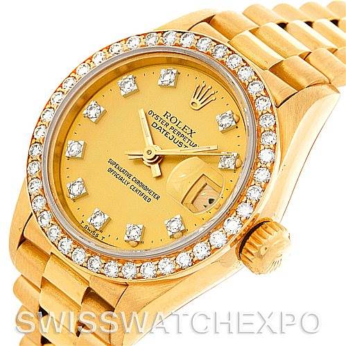 This image shows a close-up of the Rolex President 69138 Women's Yellow Gold Champagne Dial 69138 Women's Yellow Gold Champagne Dial model's face and bracelet at an angle, highlighting the diamond-studded bezel and markers.