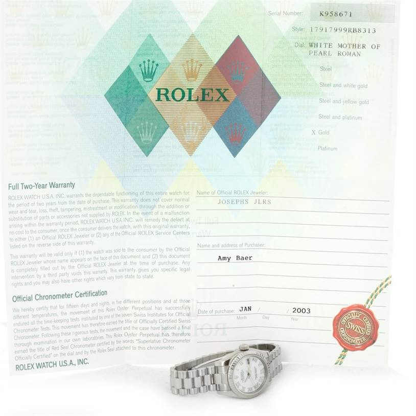 The image shows a Rolex President 179179 Women's White Gold Mother of Pearl Dial 179179 Women's White Gold Mother of Pearl Dial model watch at a slight angle, with purchase documents, including a warranty and chronometer certification.
