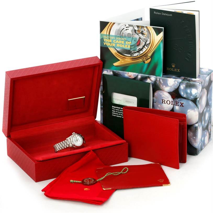 The image shows a Rolex President 179179 Women's White Gold Mother of Pearl Dial 179179 Women's White Gold Mother of Pearl Dial model watch and its accessories, including a red case, manuals, tags, and booklets.