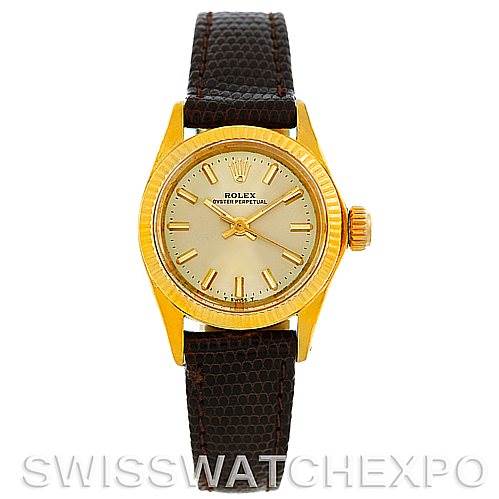 This image shows a front view of a Rolex President 6719 Women
s Yellow Gold Champagne Dial 6719 Women
s Yellow Gold Champagne Dial watch with a gold dial and a brown leather strap.