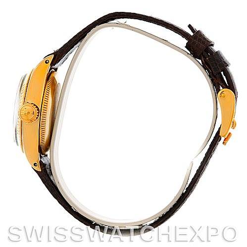 The image shows a side view of the Rolex President 6719 Women
s Yellow Gold Champagne Dial 6719 Women
s Yellow Gold Champagne Dial model watch, highlighting the crown, case, and leather strap.