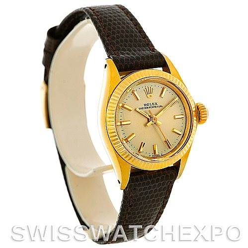The Rolex President 6719 Women
s Yellow Gold Champagne Dial 6719 Women
s Yellow Gold Champagne Dial model is shown at a slight angle, displaying its gold case, dial, crown, and brown leather strap.