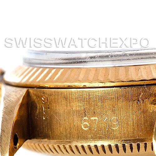 This image shows a close-up side view of a Rolex President 6719 Women
s Yellow Gold Champagne Dial 6719 Women
s Yellow Gold Champagne Dial model watch, focusing on the case with the model number "6719" engraved.