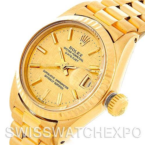 The image shows a close-up angled view of the Rolex President 6917 Women's Yellow Gold Champagne Dial 6917 Women's Yellow Gold Champagne Dial model watch, highlighting its face, bezel, and part of the bracelet and crown.