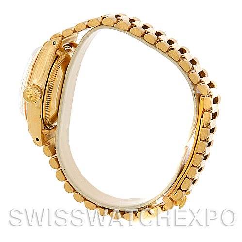 The image shows a side angle view of the Rolex President 6917 Women's Yellow Gold Champagne Dial 6917 Women's Yellow Gold Champagne Dial model watch, highlighting the bracelet and case.