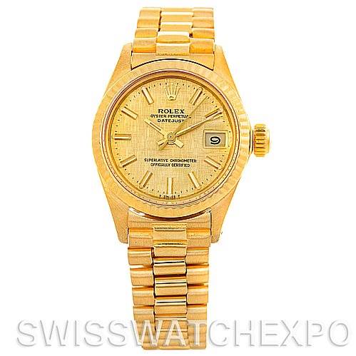 The image shows a front view of a Rolex President 6917 Women's Yellow Gold Champagne Dial 6917 Women's Yellow Gold Champagne Dial model watch, displaying its gold dial, hour markers, and date window.