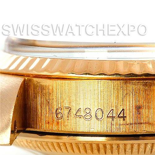 The image shows a close-up of the side of a Rolex President 6917 Women's Yellow Gold Champagne Dial 6917 Women's Yellow Gold Champagne Dial model, highlighting the fluted bezel and engraved serial number 6748044.