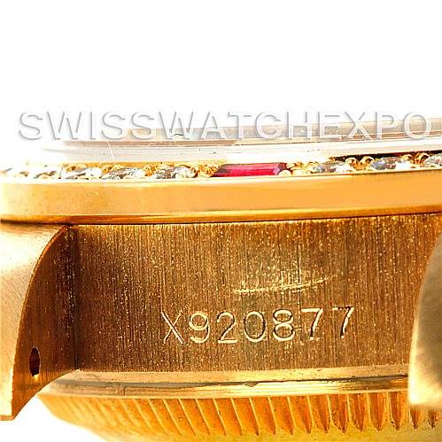 This close-up image of a Rolex President 69068 Women
s Yellow Gold Mother of Pearl Dial 69068 Women
s Yellow Gold Mother of Pearl Dial model watch shows the serial number engraved on the gold case.