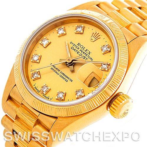 This image shows a close-up angle of a Rolex President 69278 Women's Yellow Gold Champagne Dial 69278 Women's Yellow Gold Champagne Dial model, highlighting its gold case, dial, crown, and a portion of its bracelet.