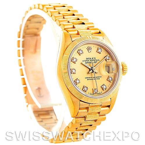 This image shows a side angle of the Rolex President 69278 Women's Yellow Gold Champagne Dial 69278 Women's Yellow Gold Champagne Dial model watch, highlighting its diamond-studded dial, fluted bezel, and gold bracelet.