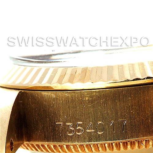 This image shows a close-up side view of the case and fluted bezel of a Rolex President 6719 Women's Yellow Gold Champagne Dial 6719 Women's Yellow Gold Champagne Dial model watch, capturing the serial number.