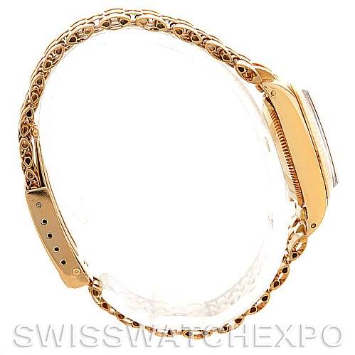 This image shows a side view of a Rolex President 6719 Women's Yellow Gold Champagne Dial 6719 Women's Yellow Gold Champagne Dial model, highlighting the intricate gold bracelet and case.