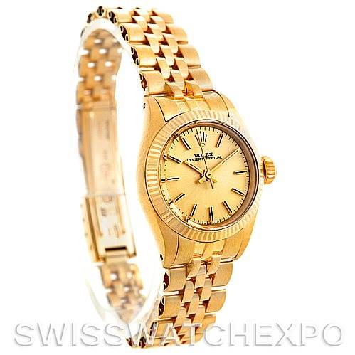 The image shows a side angle view of a gold Rolex President 6719 Women's Yellow Gold Champagne Dial 6719 Women's Yellow Gold Champagne Dial model watch, showcasing its bracelet, dial, and fluted bezel.