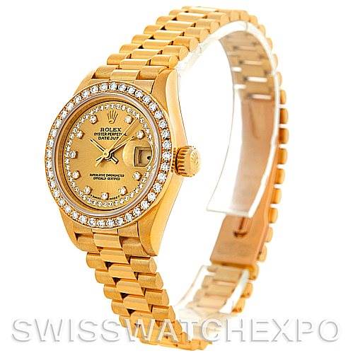 The image shows a side-angle view of a Rolex President 69138 Women's Yellow Gold Champagne Dial 69138 Women's Yellow Gold Champagne Dial model watch, highlighting its gold case, diamond bezel, dial, and the bracelet.