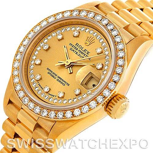 This image shows a close-up of the Rolex President 69138 Women's Yellow Gold Champagne Dial 69138 Women's Yellow Gold Champagne Dial model watch, highlighting its gold dial, diamond bezel, bracelet, and crown.