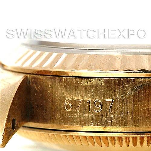 This close-up image shows the side of a Rolex President 67197 Women's Yellow Gold Champagne Dial 67197 Women's Yellow Gold Champagne Dial model watch, highlighting the case and engraved serial number 67197.