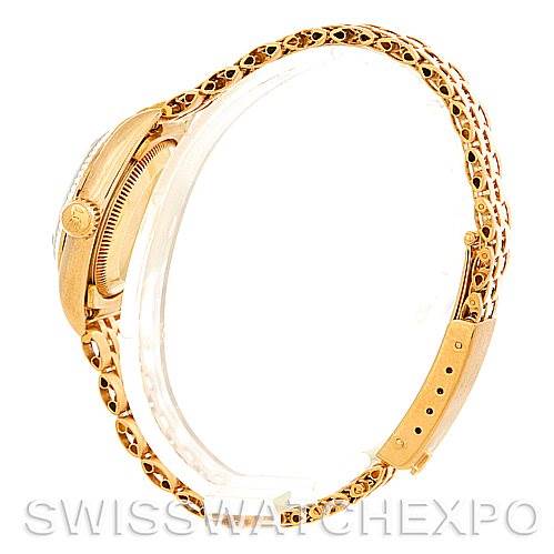 The image shows a side view of a Rolex President 67197 Women's Yellow Gold Champagne Dial 67197 Women's Yellow Gold Champagne Dial model watch, displaying the gold bracelet, crown, and clasp.