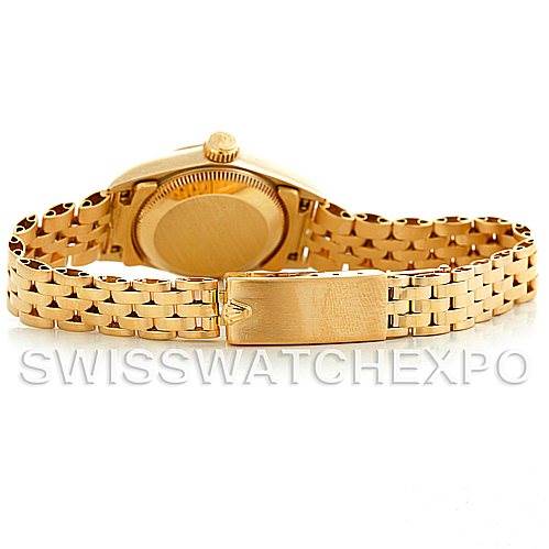 The image shows the Rolex President 67197 Women's Yellow Gold Champagne Dial 67197 Women's Yellow Gold Champagne Dial model watch from the back, highlighting the clasp and bracelet.